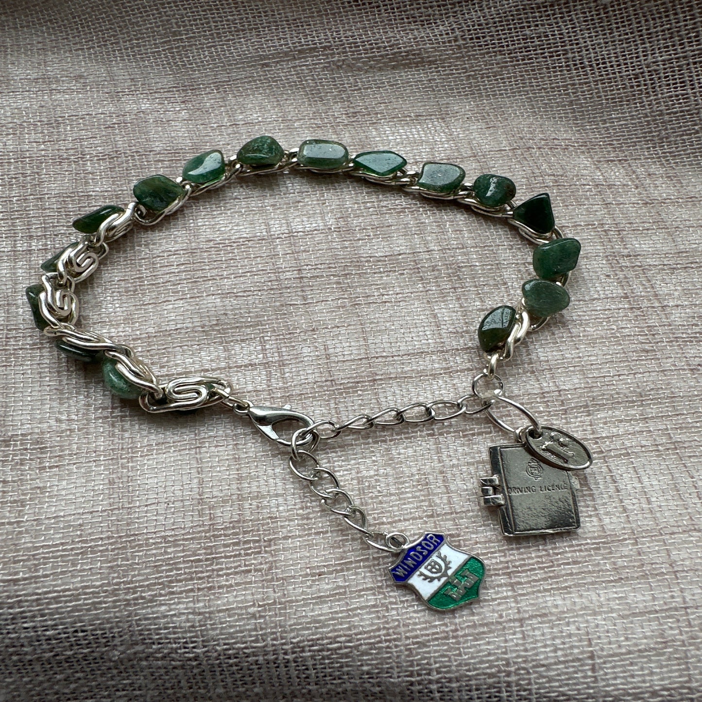 Adventure-themed charm bracelet from Regilt – vintage-inspired jewelry for travelers.