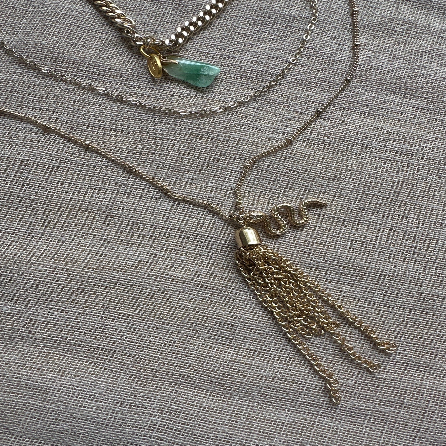 Layered vintage charm necklace by Regilt – feminine and detailed.