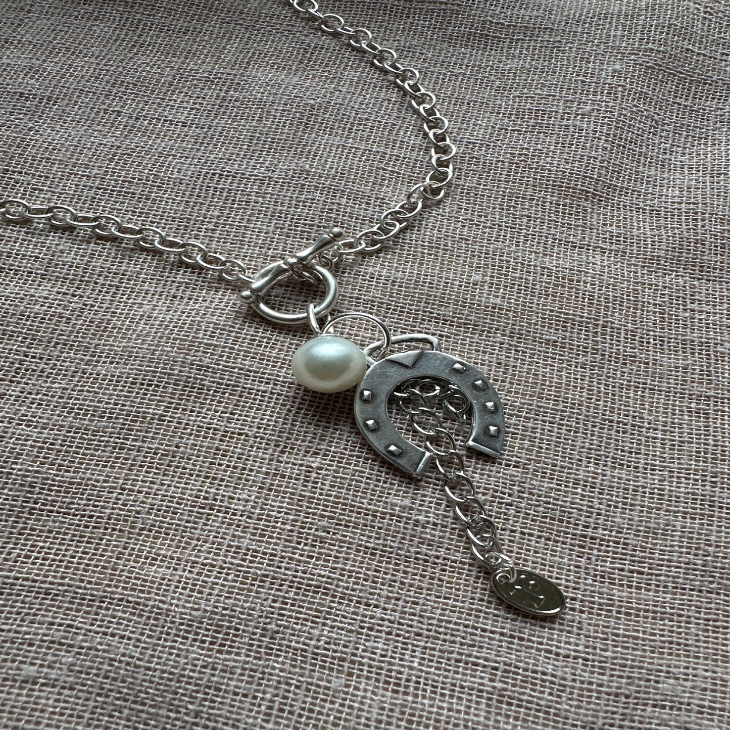Lucky charm necklace from Regilt – bold, quirky statement piece.