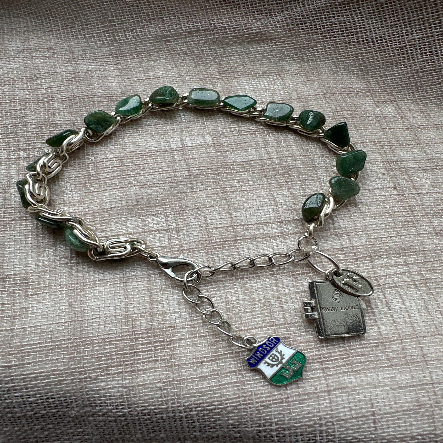 Adventure-themed charm bracelet from Regilt â€“ vintage-inspired jewelry for travelers.