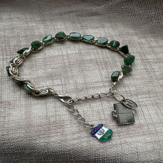 Adventure-themed charm bracelet from Regilt â€“ vintage-inspired jewelry for travelers.
