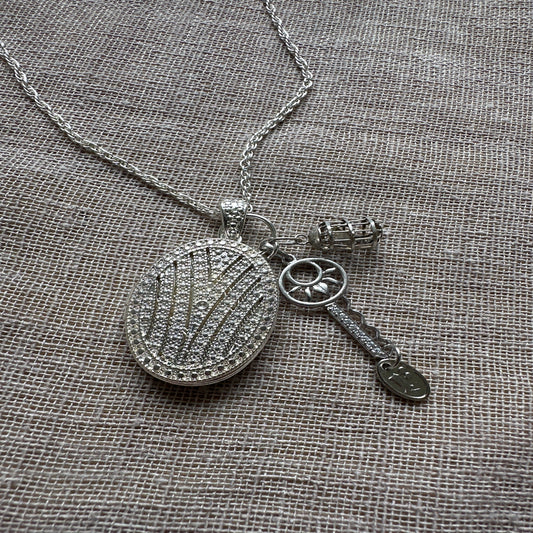Locket and key charm necklace from Regilt â€“ vintage romance jewelry.
