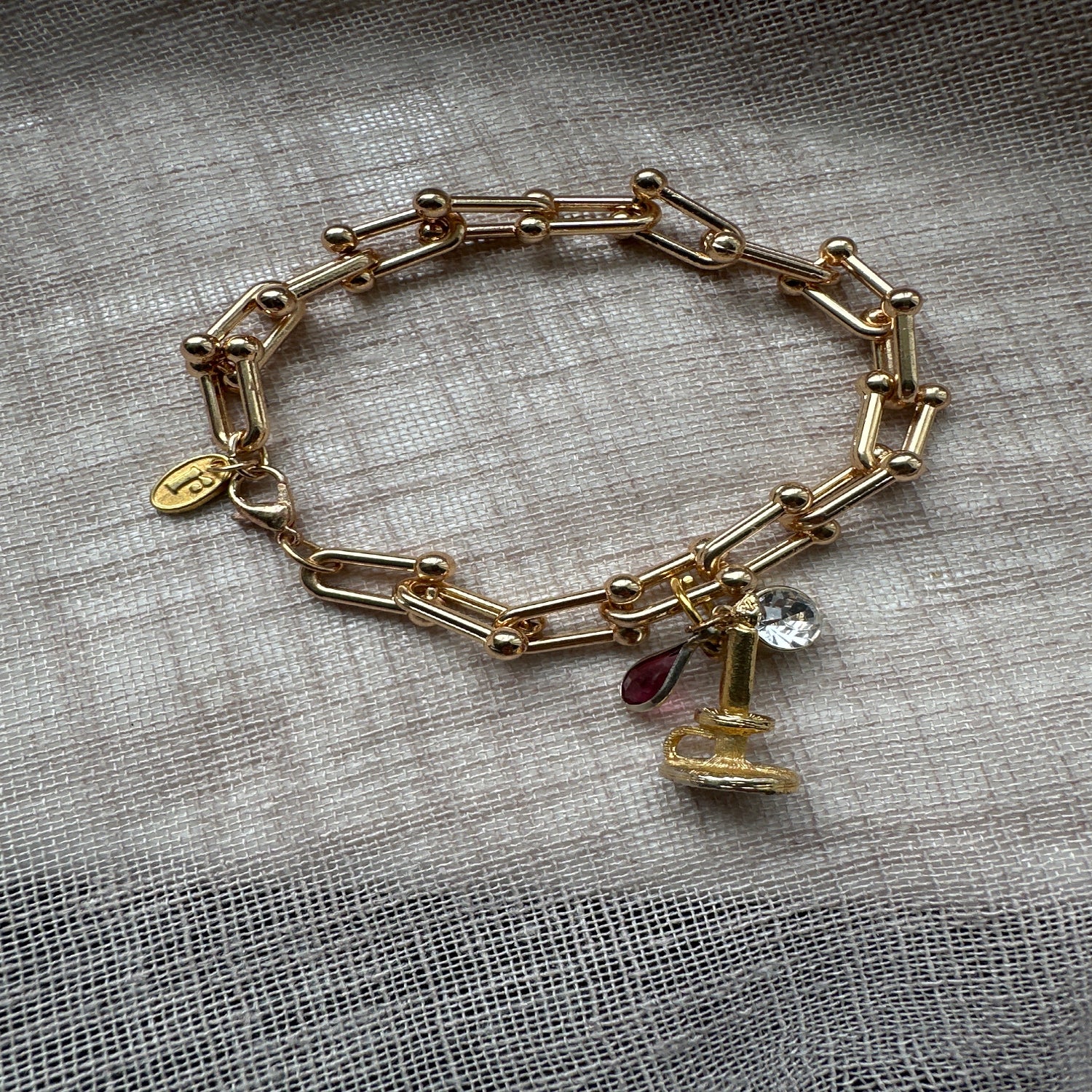 Keep Shining vintage charm bracelet from Regilt â€“ gold tone with elegant details.