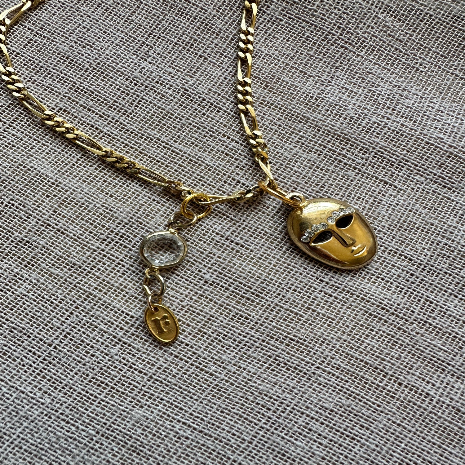 Mask charm necklace by Regilt – vintage-inspired playful jewelry.