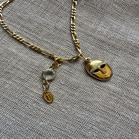 Mask charm necklace by Regilt – vintage-inspired playful jewelry.
