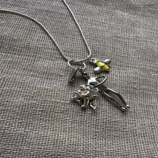 Bee charm necklace from Regilt â€“ vintage nature-inspired jewelry.